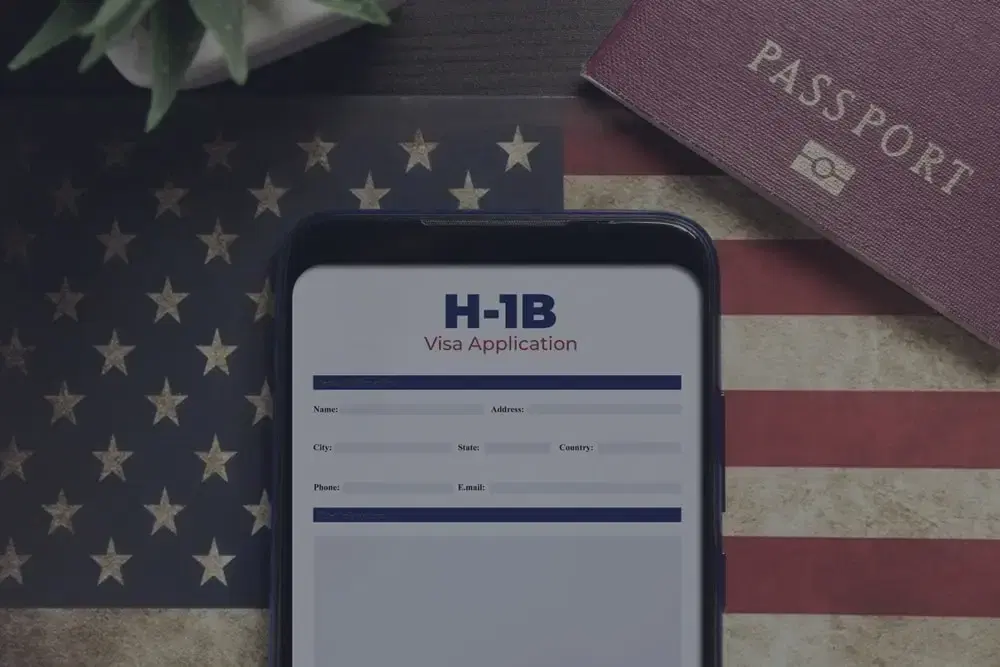 Stylized law imagery with “H-1B Cap Exempt” titled over top.