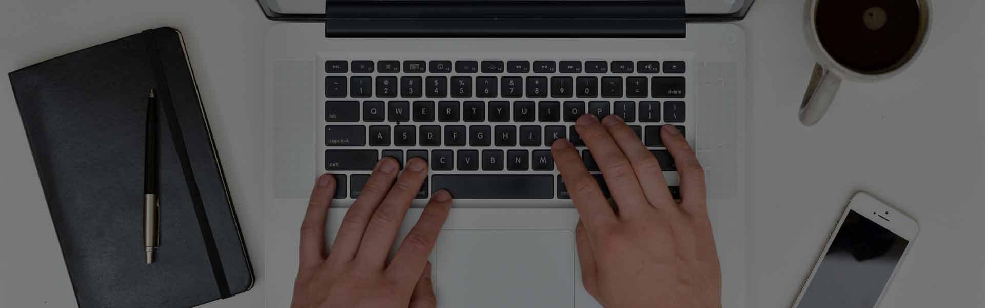 Header image showing hands typing on a computer, symbolizing the ease of contacting Quijano Law, a leading immigration law firm in Atlanta, GA, for expert immigration advice and assistance.