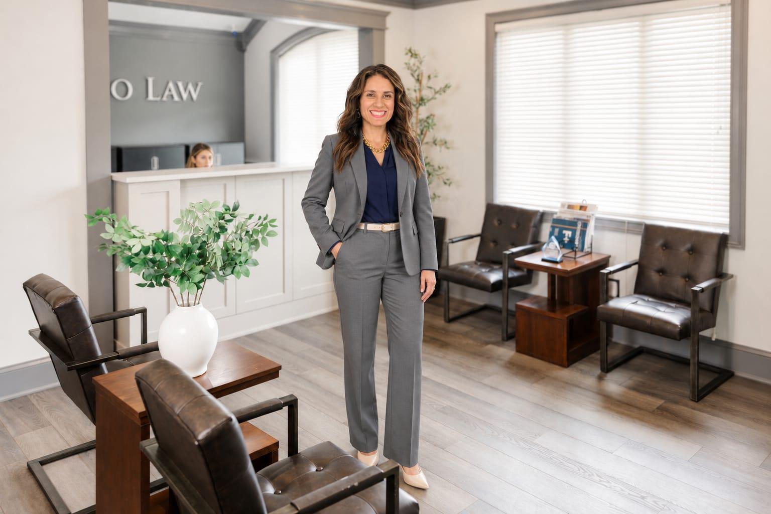 Viviana A. Quijano standing in the Quijano Law Norcross office